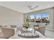 Living area showcasing serene water views, recessed lights, and neutral color palette at 9822 Desoto Ct, Bradenton, FL 34210
