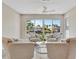 Neutral living area with water views, recessed lighting, and comfortable seating at 9822 Desoto Ct, Bradenton, FL 34210