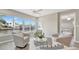 Waterfront living area with neutral furnishings, large windows and lots of natural light at 9822 Desoto Ct, Bradenton, FL 34210