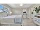 Bright main bedroom boasts natural light, ensuite bathroom, and stylish decor at 9822 Desoto Ct, Bradenton, FL 34210