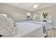 Main bedroom featuring natural light, bright ensuite bathroom, and neutral colors at 9822 Desoto Ct, Bradenton, FL 34210