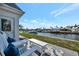 Relaxing patio with comfortable seating and serene waterfront views, perfect for enjoying the outdoors at 9822 Desoto Ct, Bradenton, FL 34210