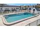 Community pool surrounded by white fencing with a 4 FT depth marking at 9822 Desoto Ct, Bradenton, FL 34210