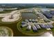 Aerial view of houses located in a residential area with waterways and landscaping at 10030 Degas Ter, Bradenton, FL 34212