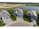 Picture of homes in a residential area with well-maintained landscaping and a lake in the background at 10030 Degas Ter, Bradenton, FL 34212