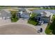 A residential neighborhood is displayed, highlighting the lush landscaping and serene lake views surrounding the homes at 10030 Degas Ter, Bradenton, FL 34212