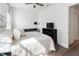 Sunlit bedroom with a cozy feel, featuring a soft comforter and a ceiling fan at 10030 Degas Ter, Bradenton, FL 34212