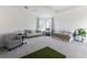 Bonus room with plenty of space for multiple seating arrangements with a ceiling projector and recessed lighting at 10030 Degas Ter, Bradenton, FL 34212