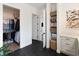 Walk-in closet with custom shelving, cabinet space, and convenient access to adjacent rooms at 10030 Degas Ter, Bradenton, FL 34212