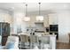 Bright kitchen features a large island with seating and modern stainless steel appliances at 10030 Degas Ter, Bradenton, FL 34212