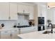 Modern kitchen features a gas range and built-in stainless-steel appliances at 10030 Degas Ter, Bradenton, FL 34212