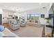 Cozy living room with comfortable seating and an open layout connecting to the kitchen at 10030 Degas Ter, Bradenton, FL 34212