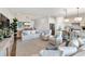 Inviting living room with stylish furnishings and a seamless flow to the kitchen area at 10030 Degas Ter, Bradenton, FL 34212