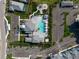 Aerial view of the community clubhouse, pool and parking at 10030 Degas Ter, Bradenton, FL 34212