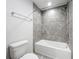 Tiled shower and tub combination at 1053 Grantham Dr, Sarasota, FL 34234