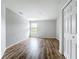 Bedroom features wood flooring, neutral paint, a window for natural light, and a closet for storage at 1053 Grantham Dr, Sarasota, FL 34234