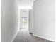 Cozy bedroom with plush carpeting, a window providing natural light, and neutral tones at 1053 Grantham Dr, Sarasota, FL 34234