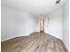 Open bedroom with wood floors and a closet, providing ample space at 1053 Grantham Dr, Sarasota, FL 34234