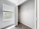 Bedroom with a closet, plush carpeting, and a window providing natural light, great for relaxation at 1053 Grantham Dr, Sarasota, FL 34234