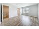 This bedroom features wood flooring, a large window, and neutral paint, creating a serene atmosphere at 1053 Grantham Dr, Sarasota, FL 34234