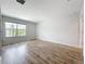 Spacious bedroom with a large window offering natural light and views of the neighborhood at 1053 Grantham Dr, Sarasota, FL 34234