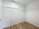 This closet features shelving, wood flooring, and ample storage space for clothes and accessories at 1053 Grantham Dr, Sarasota, FL 34234