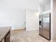 Open kitchen with stainless steel appliances and view of the staircase at 1053 Grantham Dr, Sarasota, FL 34234