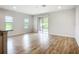Bright living room showcasing modern flooring, large sliding glass doors, and neutral tones for versatile styling at 1053 Grantham Dr, Sarasota, FL 34234