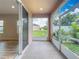 Spacious screened patio offers serene views of the green backyard at 1053 Grantham Dr, Sarasota, FL 34234