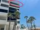 Exterior shot of condo building showing a partial ocean view from the building's balcony at 1100 Benjamin Franklin Dr # 802, Sarasota, FL 34236