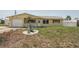 Charming single-story home featuring yellow siding, a one-car garage, and a well-maintained front yard at 1190 Jamaica Rd, Venice, FL 34293