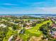 Aerial view of golf course and waterfront, showcasing the neighborhood's recreational amenities at 1324 Augusta S Ln, St Petersburg, FL 33707