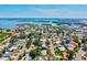 An aerial view of a waterfront community featuring a mix of homes and beautiful landscaping at 1324 Augusta S Ln, St Petersburg, FL 33707