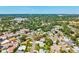 Overhead shot of a residential area with tree-lined streets and well-kept homes under a clear sky at 1324 Augusta S Ln, St Petersburg, FL 33707