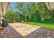 Spacious backyard featuring a lush lawn, brick-paved patio, and privacy landscaping at 1324 Augusta S Ln, St Petersburg, FL 33707