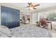 Bedroom featuring a ceiling fan, large blue closet and large windows for natural light at 1324 Augusta S Ln, St Petersburg, FL 33707