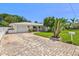 Inviting single-story home featuring a brick driveway and well-kept lawn at 1324 Augusta S Ln, St Petersburg, FL 33707