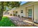 Covered walkway featuring brick pavers leading to a bright, inviting entryway at 1324 Augusta S Ln, St Petersburg, FL 33707