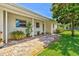 Comfortable single-story home featuring a brick walkway and shade trees at 1324 Augusta S Ln, St Petersburg, FL 33707