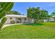 Lovely home featuring a well-maintained lawn and brick walkway at 1324 Augusta S Ln, St Petersburg, FL 33707