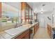 Bright kitchen with natural light, features a ceramic sink, wood cabinets and stainless steel appliances at 1324 Augusta S Ln, St Petersburg, FL 33707