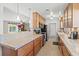 Well-lit kitchen with modern appliances, ample counter space, and view to the adjacent breakfast bar and living area at 1324 Augusta S Ln, St Petersburg, FL 33707