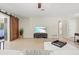 Open-concept living room showcases terrazzo floors, modern decor, large sliding barn door, and a comfortable sofa at 1324 Augusta S Ln, St Petersburg, FL 33707