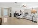 Large open-concept living area features terrazzo floors, comfortable seating, and plenty of room to entertain at 1324 Augusta S Ln, St Petersburg, FL 33707