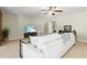 Spacious living room with comfortable seating, entertainment center, and views throughout the open floorplan at 1324 Augusta S Ln, St Petersburg, FL 33707