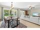 Bright and open living space combining the dining and living areas featuring plenty of natural light and seating at 1324 Augusta S Ln, St Petersburg, FL 33707
