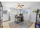 Functional home office setup with dual monitors, natural light, and a ceiling fan at 1324 Augusta S Ln, St Petersburg, FL 33707