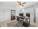 A well organized office space with dual monitors, a ceiling fan, and ample storage at 1324 Augusta S Ln, St Petersburg, FL 33707