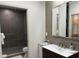 Modern bathroom featuring a glass-enclosed shower, sleek vanity, and contemporary fixtures at 1345 2Nd St, Sarasota, FL 34236