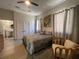 Charming bedroom with a cozy bed, inviting decor, and a view into the adjacent bathroom at 1345 2Nd St, Sarasota, FL 34236